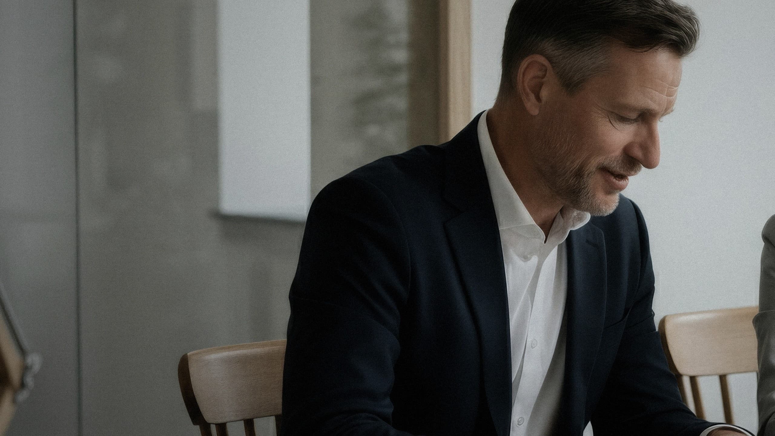 Professional reviewing work in a quiet meeting space